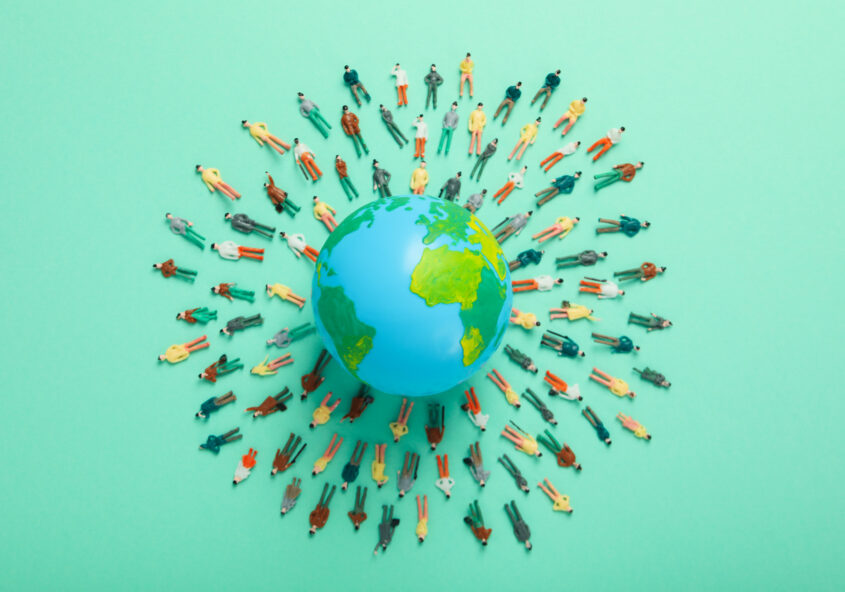 People around a globe.